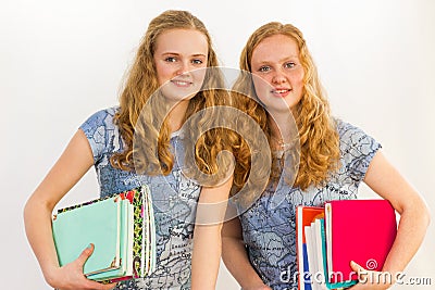 Schoolgirls carrying textbooks Stock Photo