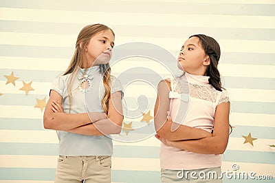 Schoolgirls haughty arrogant with folded arms chest. Best friends become enemies. Friendship relations issues. Girlish Stock Photo