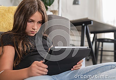 Schoolkid spending too much time on mobile device Stock Photo