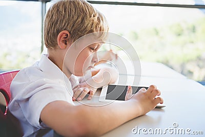 Schoolkid using digital tablet in classroom Stock Photo