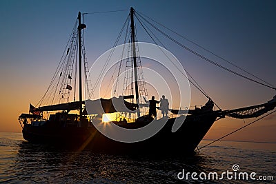 Schooner Pirate Ship in Sunset Stock Photo