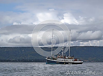 Schooner rigged motor sailer in the bay Stock Photo