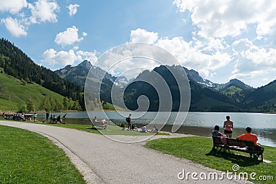 Schwarzsee, FR / Switzerland - 1 June 2019: tourists enjoy a day out on the shores of Schwarzsee Lake in Fribourg Editorial Stock Photo
