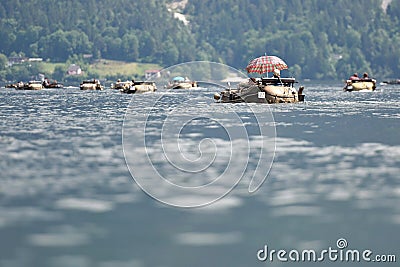 Swimming car meeting in the Salzkammergut Traunsee, Gmunden district, Upper Austria, Austria Editorial Stock Photo