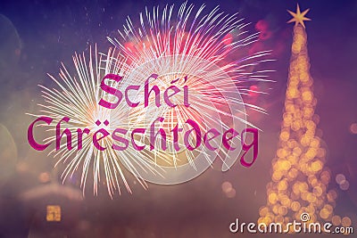 SchÃ©i ChrÃ«schtdeeg means Merry Christmas in Luxembourgish . Blurred background of decorated Christmas tree with golden lights. Stock Photo