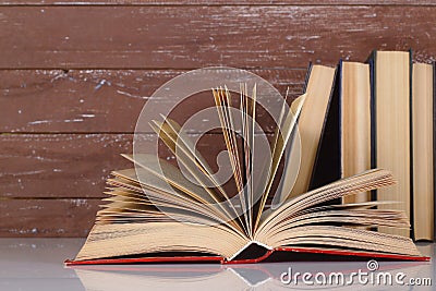 Science and education - Open book on a group books and wooden. Reflection Stock Photo