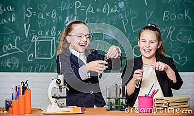 Science experiments in laboratory. Biology lab. Happy Genius. Chemistry research in laboratory. Little girls scientist Stock Photo