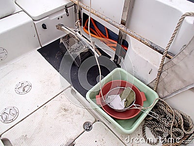 The science equipment: benthic grab sampler, square basin and sieve on the boat Stock Photo