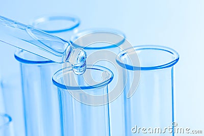 Science laboratory test blue tubes, macro flask equipment. Chemical dropper Stock Photo