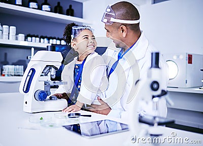 Science, microscope and father with child in laboratory for medical research, chemistry and education. Healthcare Stock Photo