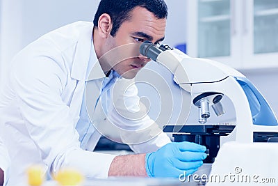 Science student looking through microscope in the lab Stock Photo