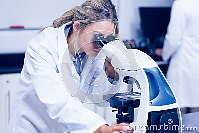 Science student looking through microscope in the lab Stock Photo