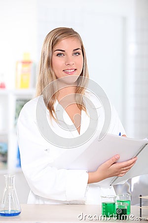 Science student noting results Stock Photo