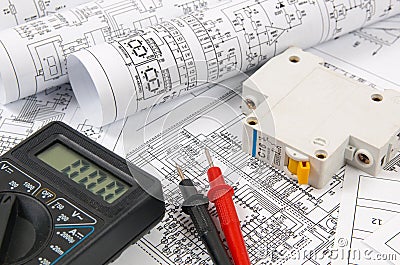 Science, technology and electronics. Electrical engineering drawings printing with circuit breaker and mulyimeter. Scientific deve Stock Photo