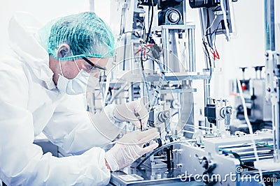 Science worker engineer service fix repair advance machine in medical equipment hygine factory Stock Photo