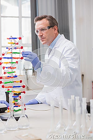 Scientist analysing dna helix Stock Photo