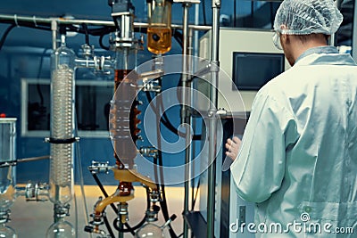 Scientist or apothecary in lab extract CBD hemp oil for medical purpose. Stock Photo