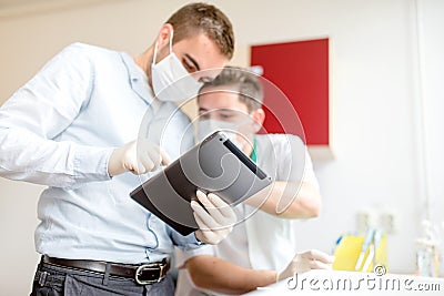 Scientist college students making experiments and learning from tablet Stock Photo