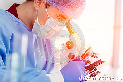 Scientist Doctor dressing PPE protective suit working in medical lab for finding anti virus vaccine Stock Photo