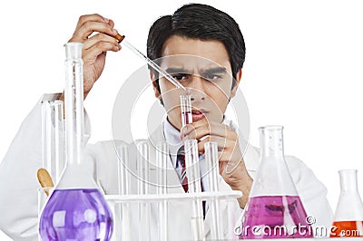 Scientist doing scientific experiment in a laboratory Stock Photo