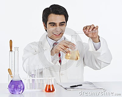 Scientist doing scientific experiment in a laboratory Stock Photo