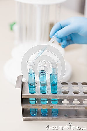 Scientist doing scientific experiment in test tube Stock Photo