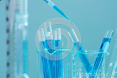 Scientist hand titration with burette and erlenmeyer flask, science laboratory research and development concept. Biology, liquid. Stock Photo