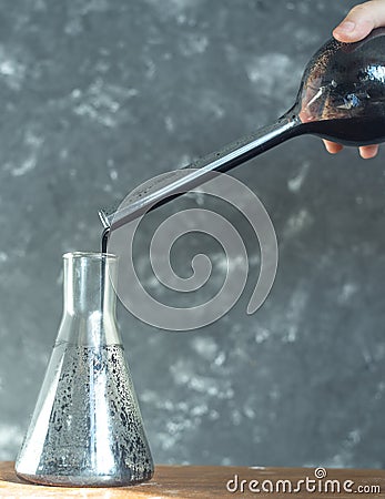 Scientist hands researcher working in laboratory and test tube crude oil. Stock Photo