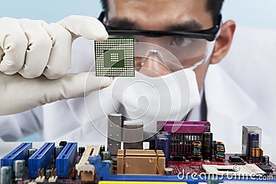 Scientist holding a computer microchip Stock Photo