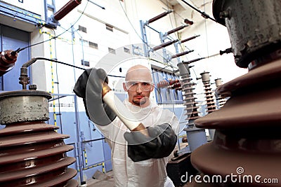 Scientist holding large fuse Stock Photo