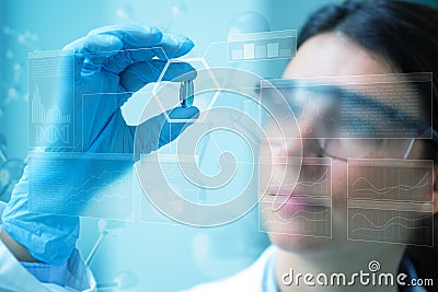 Scientist holding a pill Stock Photo