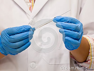 Scientist holds syringe for laboratory analysis Stock Photo