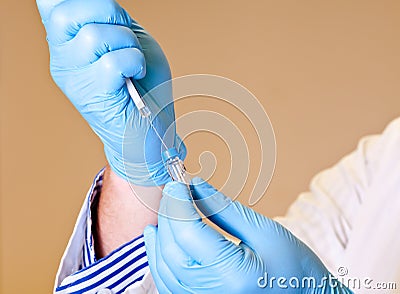 Scientist holds syringe for laboratory analysis Stock Photo