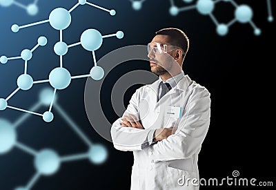 Scientist in lab coat and goggles with molecules Stock Photo