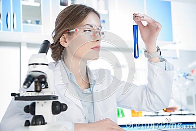 Scientist looking on test tube Stock Photo