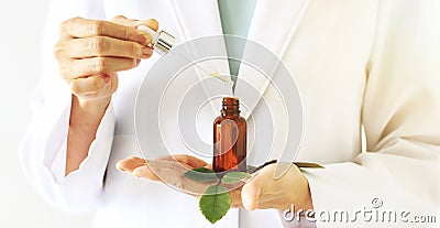 Scientist with natural drug research, Green herbal medicine discovery at science lab. Stock Photo