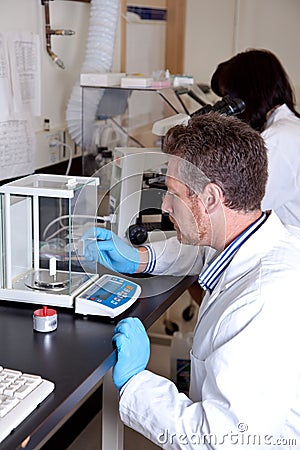 Scientist performs calibration service Stock Photo