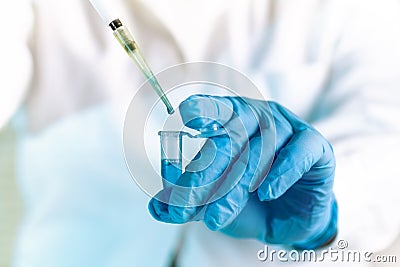 Scientist pipetting medical sample in pcr tube in the laboratory Stock Photo