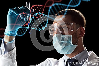 Scientist with test tube and dna molecule Stock Photo
