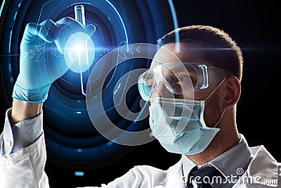 Scientist with test tube and virtual projection Stock Photo