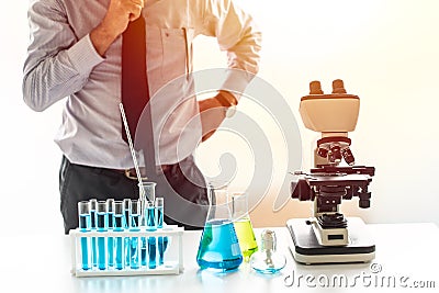 Scientist thinking to research and development in chemical lab Stock Photo