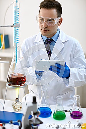 Scientist using data in laboratory Stock Photo