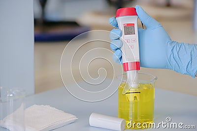 The scientist work at handle pH meter Stock Photo