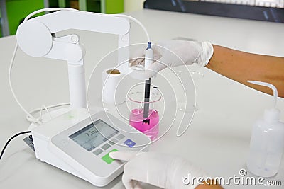 The scientist work at pH meter Stock Photo