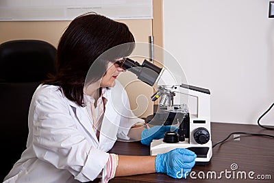 Scientist works with microscope Stock Photo