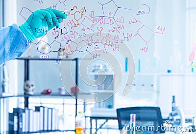 The scientists, chemists, researcher discover the chemical formula write on whiteboard in laboratory. The researcher discover Stock Photo