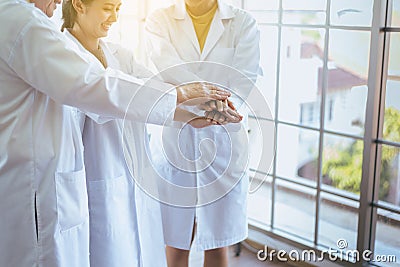 Scientists coordinate hands,Group of diversity people teamwork in laboratory,Successful and reserch working Stock Photo