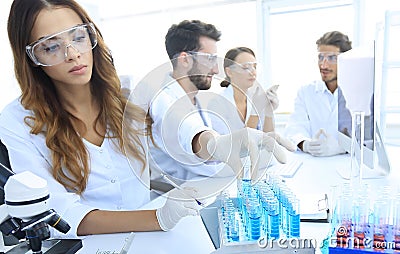 Scientists examining in the lab with test tubes. Stock Photo