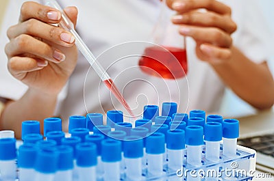 Scientists experimenting in laboratory Stock Photo