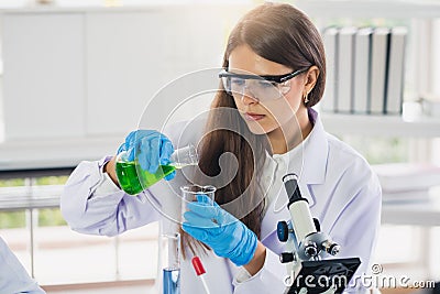 The scientists are hard-working for Invented the anti-coronavirus vaccine formula in the laboratory. the concept of coronavirus, v Stock Photo